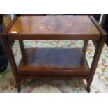 A 19th century walnut two tier adjustable table.