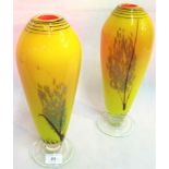 A pair of 20th century studio art glass vases, with tree-style decoration on a yellow ground,