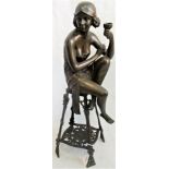 A contemporary bronzed figure of a 1920's style champagne girl on a bar stool, 56cm tall.