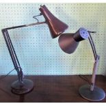 Two angle-poise lamps.