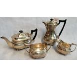 A four piece silver tea set, consisting: teapot, coffee pot, milk jug and sugar bowl,