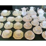 A Paragon part-tea service, comprising: eight trios, two cake plates, sugar bowl and milk jug,