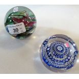 Two glass paperweights.