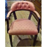 A reproduction mahogany framed and upholstered elbow chair.