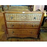 A 20th century faux bamboo and cane three drawer chest.