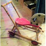 A 1950's child's push-along wooden horse.