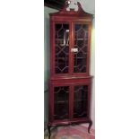 An Edwardian mahogany and inlaid corner cupboard,