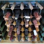 Sixteen bottles of mixed champagne and other sparkling wines, to include wine rack.