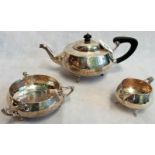 A three piece tea set, to include: teapot, milk jug and sugar bowl,