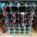 Twelve bottles of mixed red wine, to include wine rack.