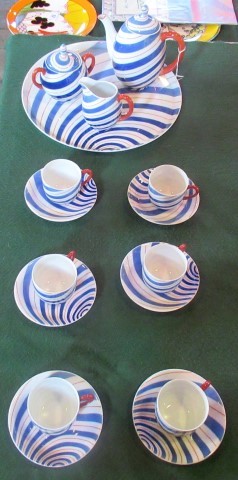 A contemporary coffee service, comprising: six coffee cups & saucers, coffee pot, milk jug,