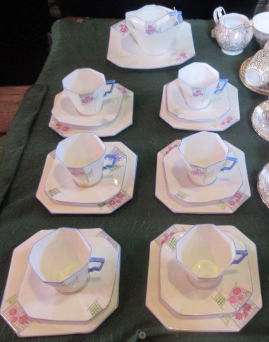 A Windsor china hand painted tea service, comprising: six trios, cake plate,