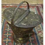 A brass Art Nouveau-style twin lidded coal bucket.