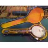 A cased Gold Star five string banjo. Condition Report: Slight scratches to back.