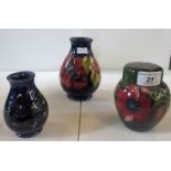 Three items of Moorcroft pottery, to include: ginger jar, posy vase and a further small vase,