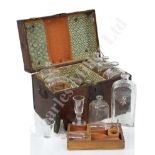 AN EARLY 19TH CENTURY TRAVELLING DECANTER SET