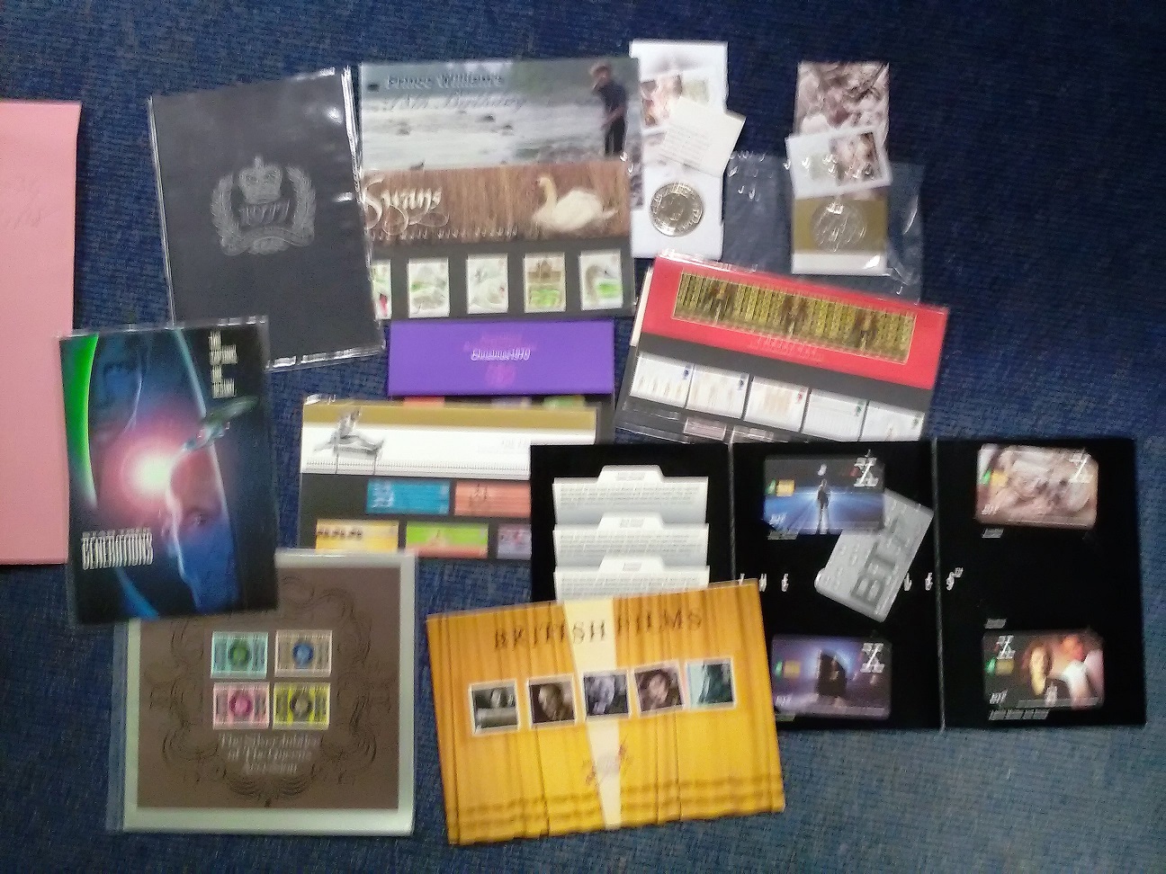 Assorted stamp and telephone card souvenir pack collection. 12 items mainly GB. Does include 2 £5