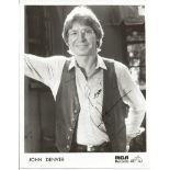 John Denver signed 10 x 8 b/w RCA records photo. Good Condition. All signed items come with our