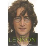 Cynthia Lennon, Julian Lennon and one other signed John Lennon the life hardback book. Signed on