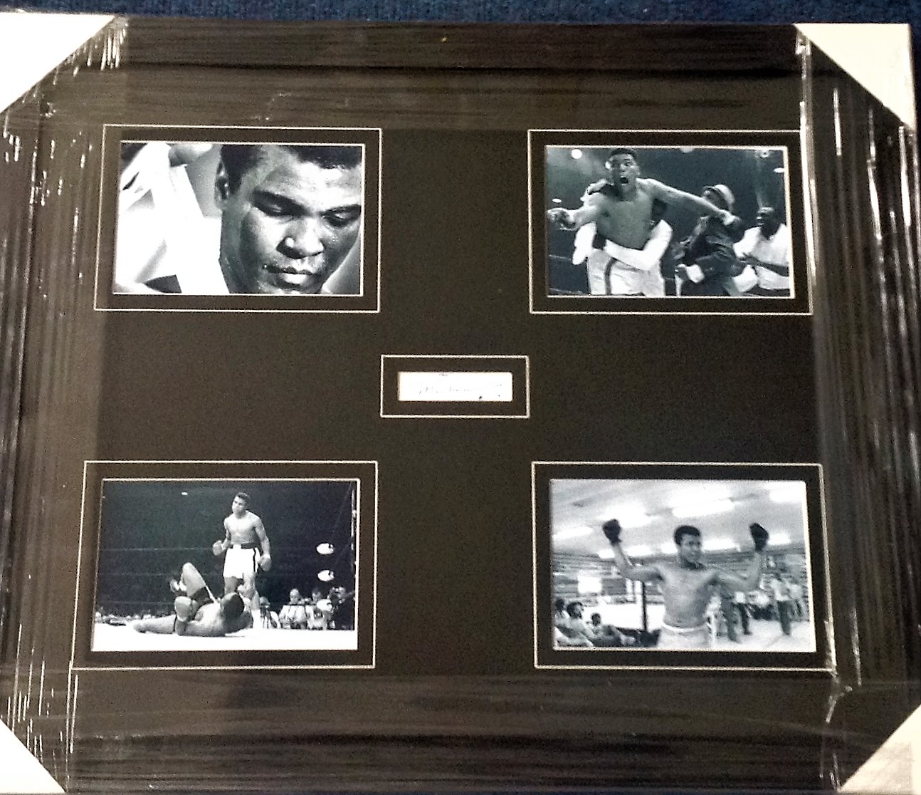 Muhammed Ali signature piece. Professionally mounted and framed in the centre with 4 6x4 b/w