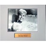 Doris Day signed 12x8 b/w photo from Pillow Talk. Mounted to approx. overall size 16x12. Good