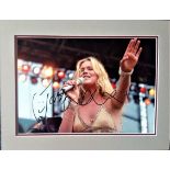 Joss Stone signed 12x8 colour photo of the singer on stage. Mounted to approx. size 16x12. Good