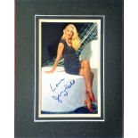 Jerry Hall signed 10x8 colour portrait photo. Mounted to approx. 16x12 size. Good condition. All