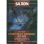 Saxon signed A4 colour magazine page. English heavy metal band formed in 1977, in Barnsley. Signed