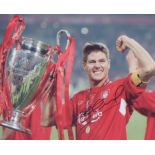 Steven Gerrard signed 10 x 8 photo holding Champions League Trophy in Istanbul. Good Condition.