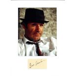 Gene Hackman signature piece mounted below colour photo. American actor and novelist. In a career