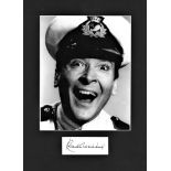 Kenneth Williams signature piece mounted below b/w photo. Approx. overall size 14x10. English actor,