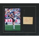 Bobby Charlton signature piece mounted alongside colour photo. Approx. overall size 12x10. Good