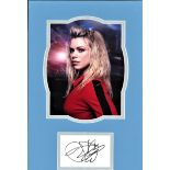 Billie Piper signature piece mounted below colour photo from Dr Who. Approx. overall size 11x17.