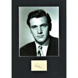 Rock Hudson signature piece mounted below b/w photo. Approx. overall size 15x11. American actor,