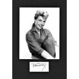 Doris Day signature piece mounted below b/w photo. Approx. overall size 15x11. American actress,