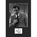 Robert Vaughn signature piece mounted below b/w photo. Approx. overall size 15x11. American actor