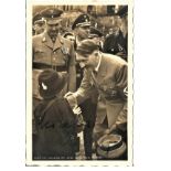 Adolf Hitler signed 6 x 4 b/w Hoffman portrait photo. Meeting a little girl with other Top officers.