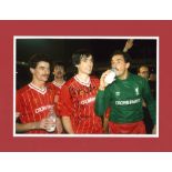 Alan Hansen signed colour Liverpool photo. Mounted to approx. size 14x11. Good Condition. All signed