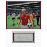 Bobby Moore 1970 World cup autograph presentation. High quality professionally mounted 15 x 13