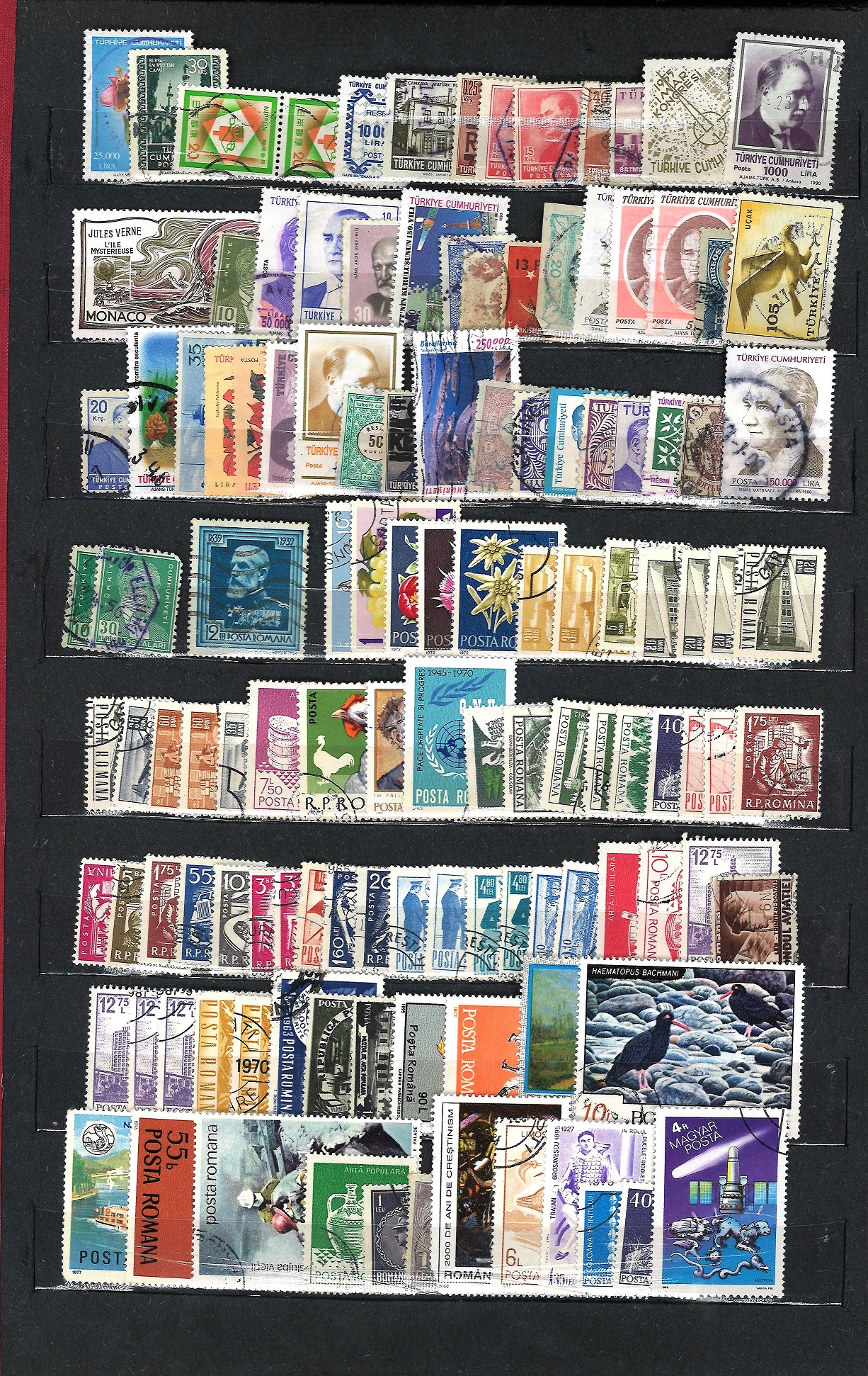 World stamp collection in red stockbook 20 pages of stamps from around the world including USA and