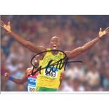 Usain Bolt signed 12x8 colour photo. Good Condition. All signed pieces come with a Certifcate of