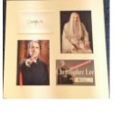 Christopher Lee signed white card, mounted with colour photos. Approx overall size 16x16. Good