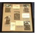 Jean Claude Van Damme, Chuck Norris, Jason Statham and Dolph Lundgren signed white cards. Mounted
