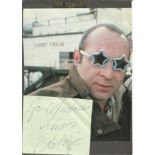 Bob Hoskins signed album page stuck to colour newspaper photo. Good Condition. All signed pieces