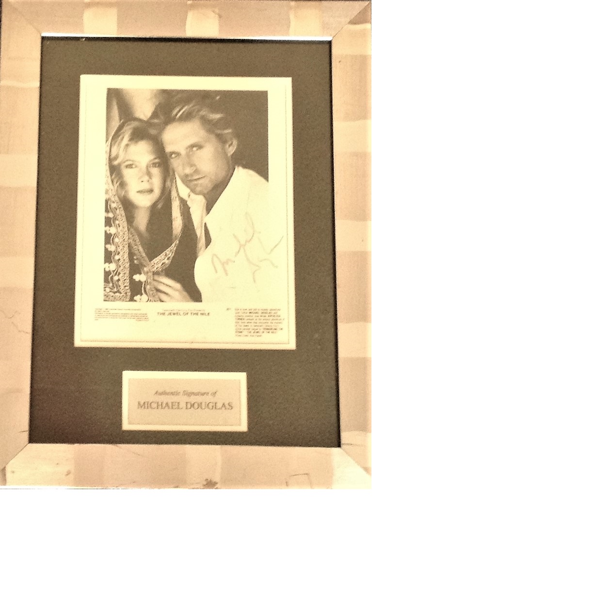 Michael Douglas signed b/w photo from The Jewel of the Nile. Mounted and framed to approx 18.5x14.