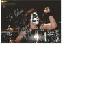 Kiss signed 7x5 colour photo. Good Condition. All signed pieces come with a Certificate of