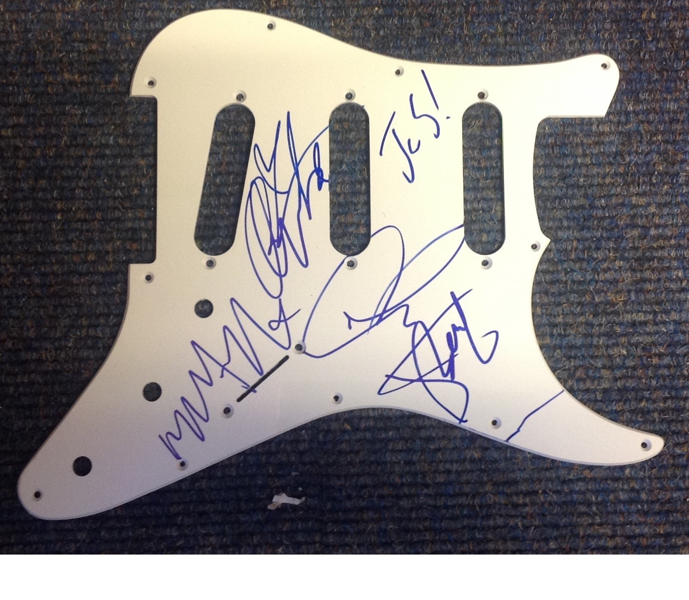 JLS guitar plate signed by band members Aston Merrygold, Oritse Williams, Marvin Humes, and JB Gill.
