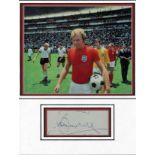Bobby Moore World cup autograph presentation. High quality professionally mounted 15 x 13 inch