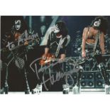 Kiss signed 7x5 colour photo. Good Condition. All signed pieces come with a Certificate of