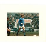 Football Colin Bell signed 12x14 mounted colour photo pictured in action for Manchester City.